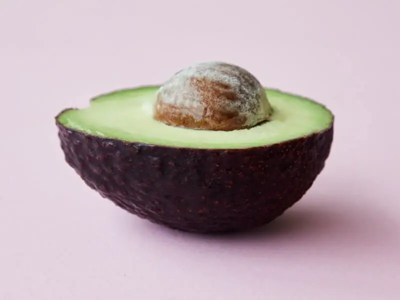 half an avocado with the seed
